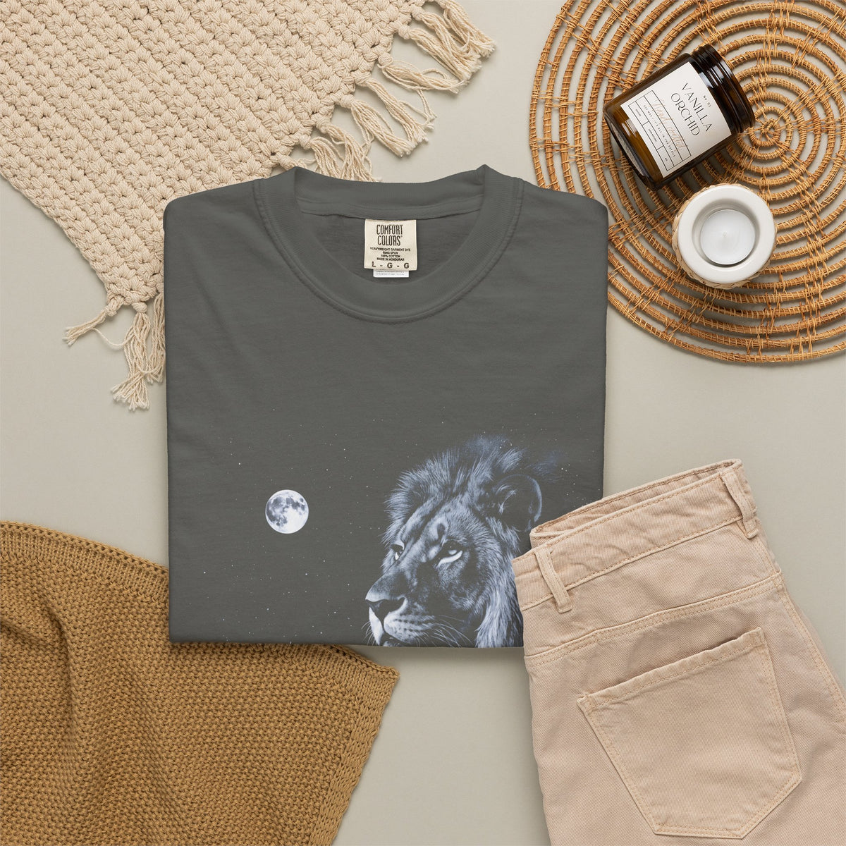 Airbrushed 1990s-style art of a lion howling at the moon in cold white, silver, and ice-blue tones on black.