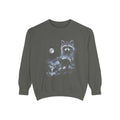 Airbrushed raccoon howling at a cold white moon, monochrome mist and spatter on black, 90s nature-tee style.