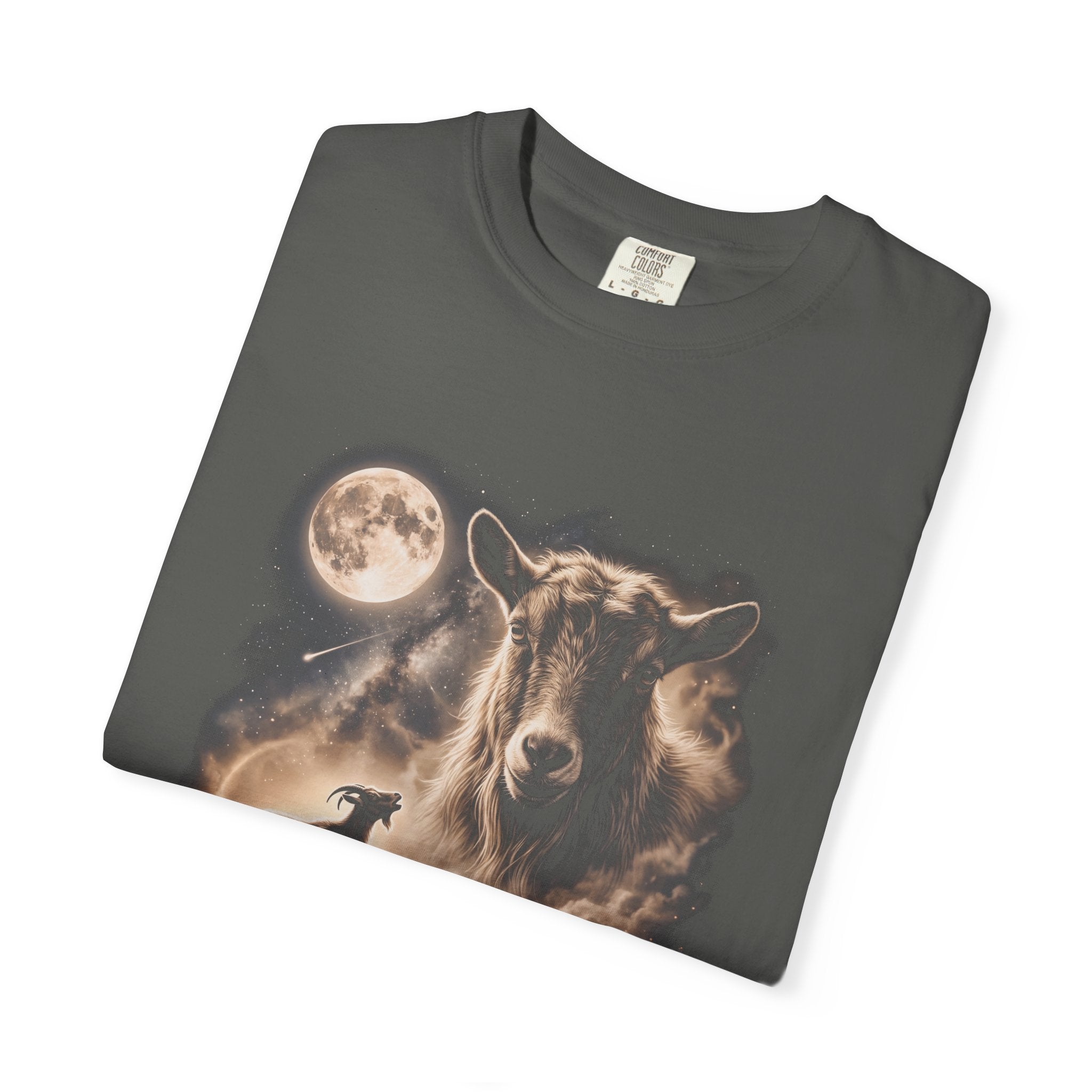 Dark t-shirt with airbrushed portrait of a goat above it howling at a full moon over misty fields