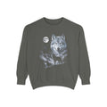 Airbrushed wolf howling at a cold moon in ice-blue, silver and violet on black, 1990s nature-tee style.