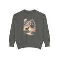 Dark crewneck with airbrushed capybara portrait above a small capybara howling at a full moon over misty ground