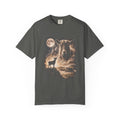 Dark t-shirt with airbrushed portrait of a goat above it howling at a full moon over misty fields