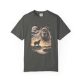 Photorealistic double-exposure design of a capybara howling at a full moon over misty hills, in cream and gold on a dark tee.
