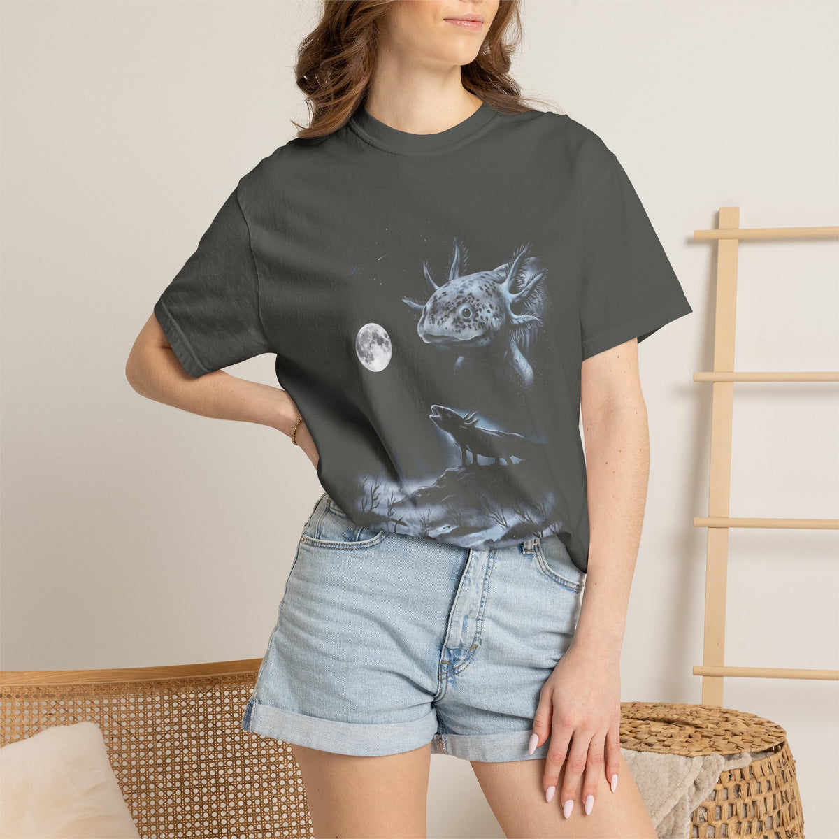 Airbrush-style illustration of an axolotl howling at a pale moon, in cold moonlit greys and blues on black.