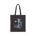 Airbrushed goat howling at a full moon in cold monochrome moonlight, 1990s nature-tee style, on black canvas tote.