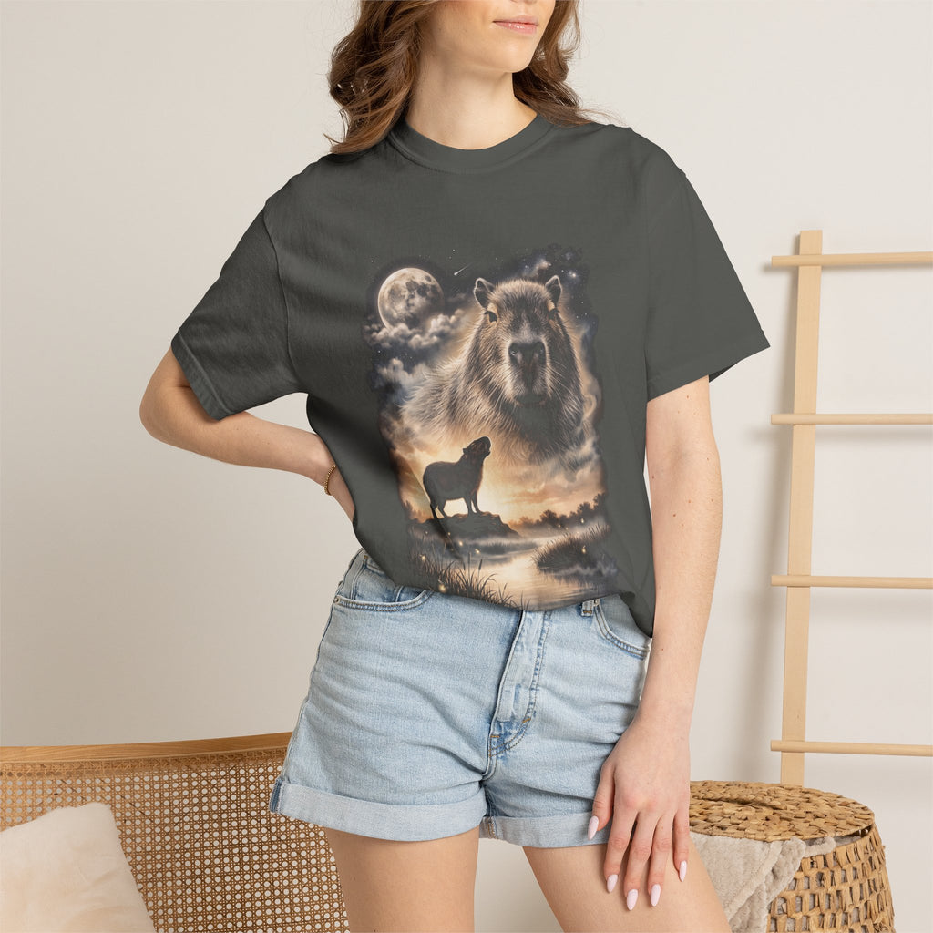 Photorealistic double-exposure design of a capybara howling at a full moon over misty hills, in cream and gold on a dark tee.