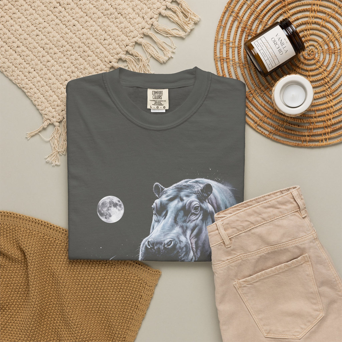 Airbrushed hippo howling at a full moon in cold monochrome blues, greys and violet on black, 1990s nature-tee style.