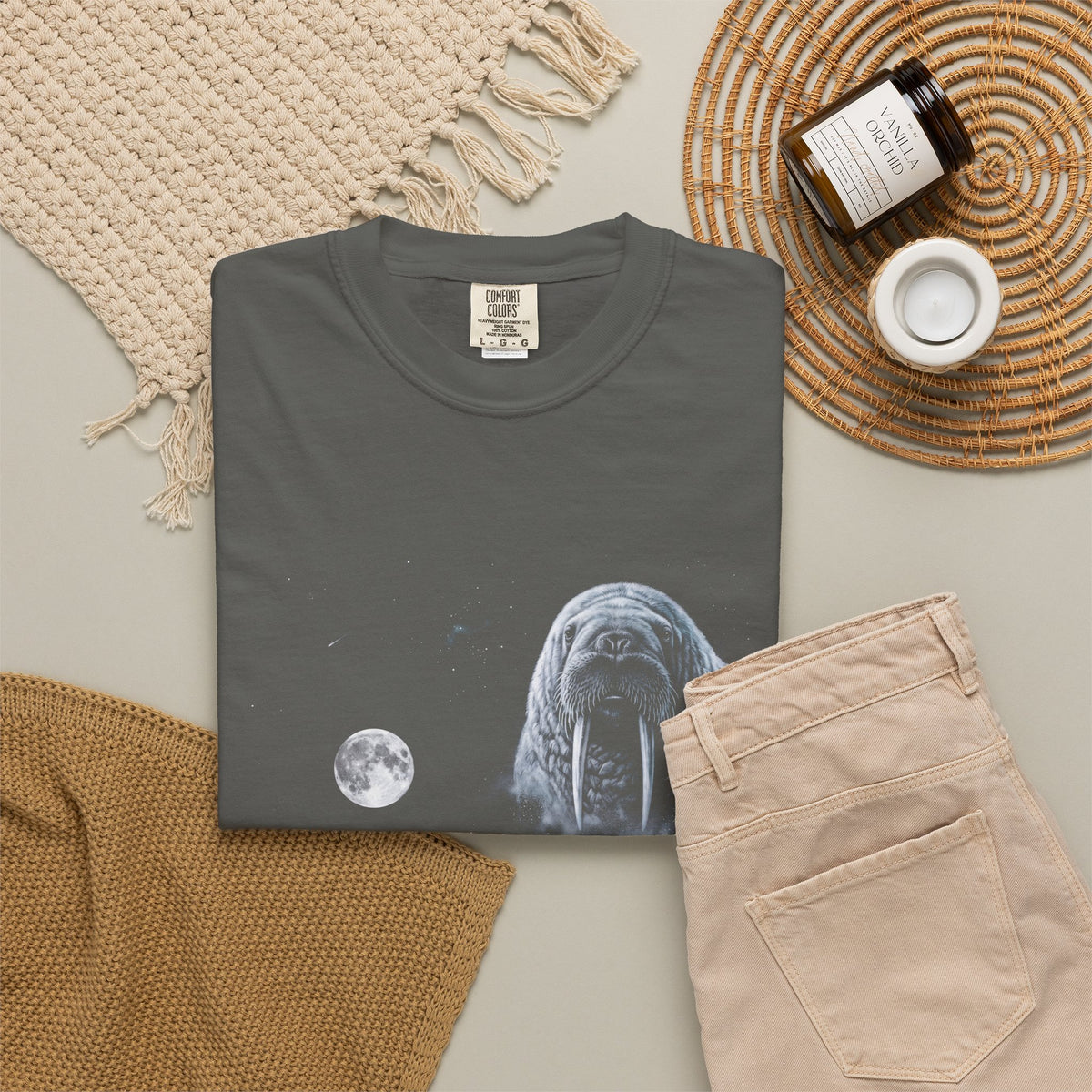 Retro airbrushed walrus howling at the moon in white, silver, and ice blue on black, 90s nature-tee style.