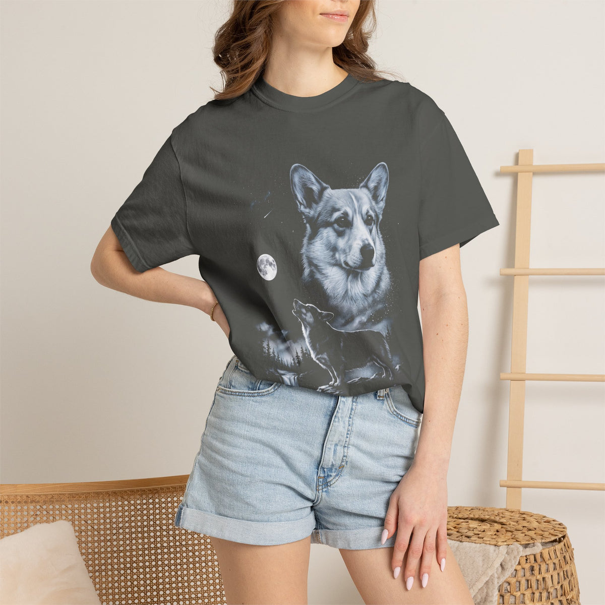 Retro 90s airbrushed corgi howling at a full moon in cold moonlight, printed on a black tee.