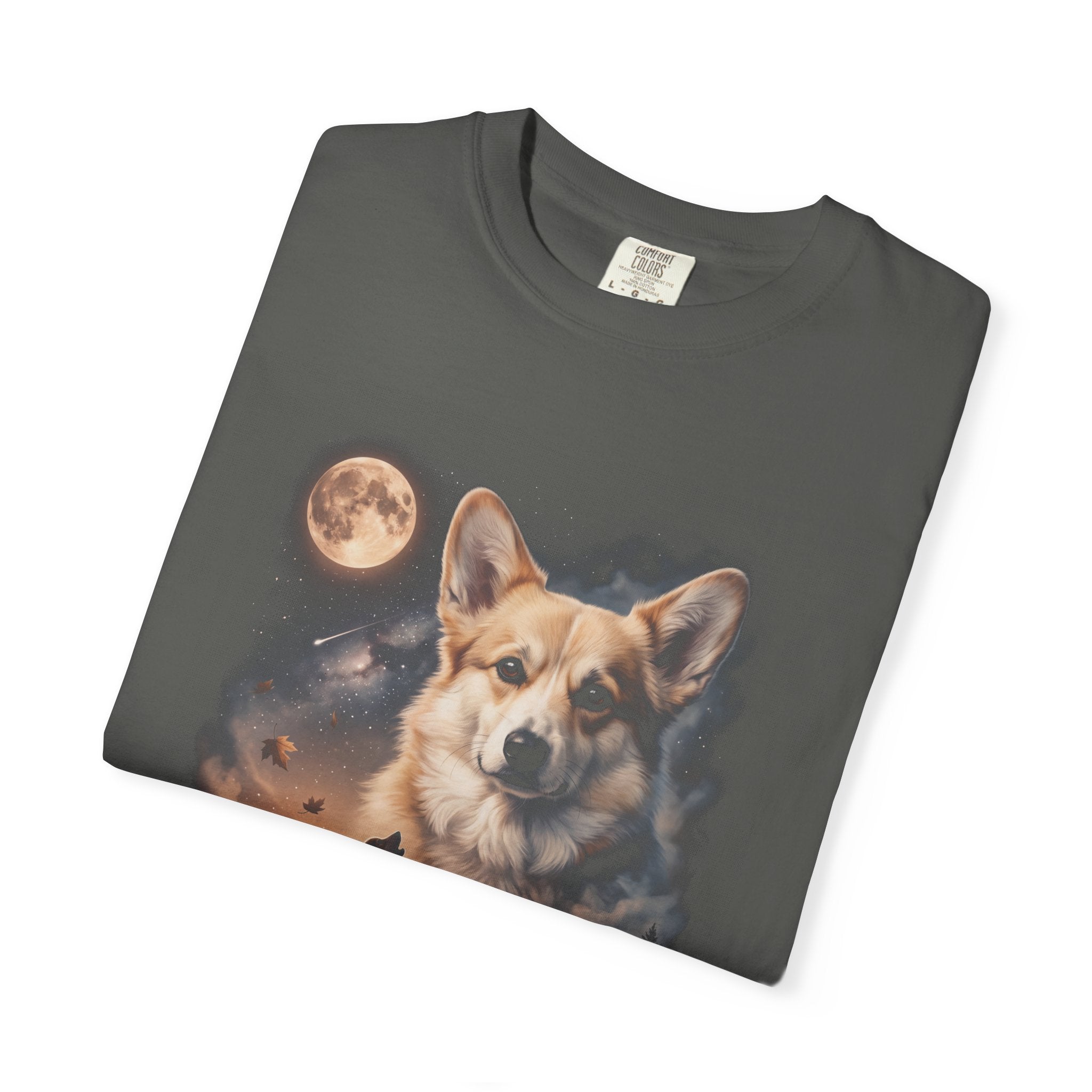 Dark tee with cream and gold double-exposure art of a corgi howling at a full moon over misty hills