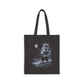Black tote bag with airbrushed capybara howling at the moon in cold white, silver and ice-blue tones on near-black.