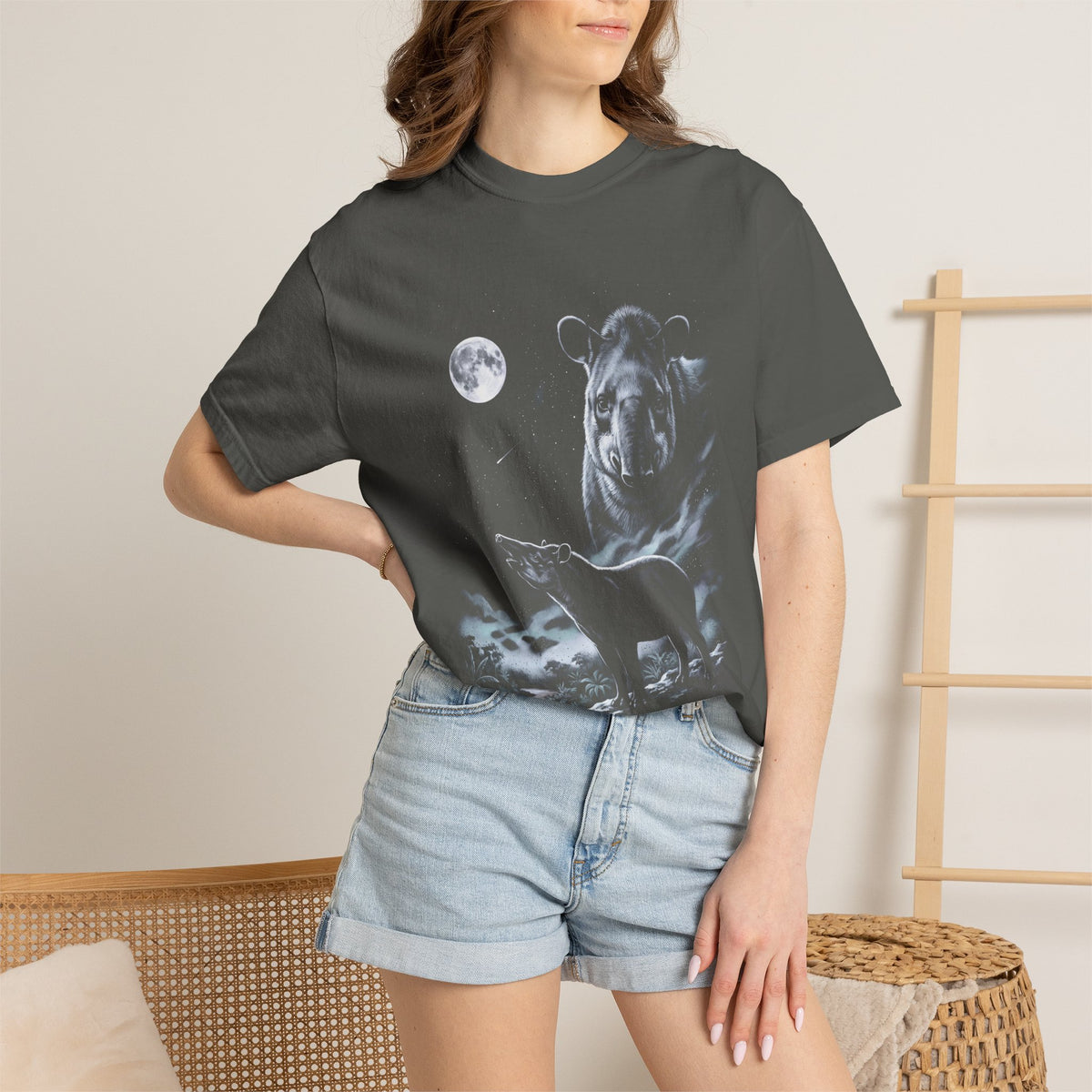 Airbrushed 90s-style tapir howling at a cold, near-monochrome moon in silver, ash grey, and ice blue on black.